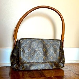 Authentic Discontinued Louis Vuitton small Looping bag.